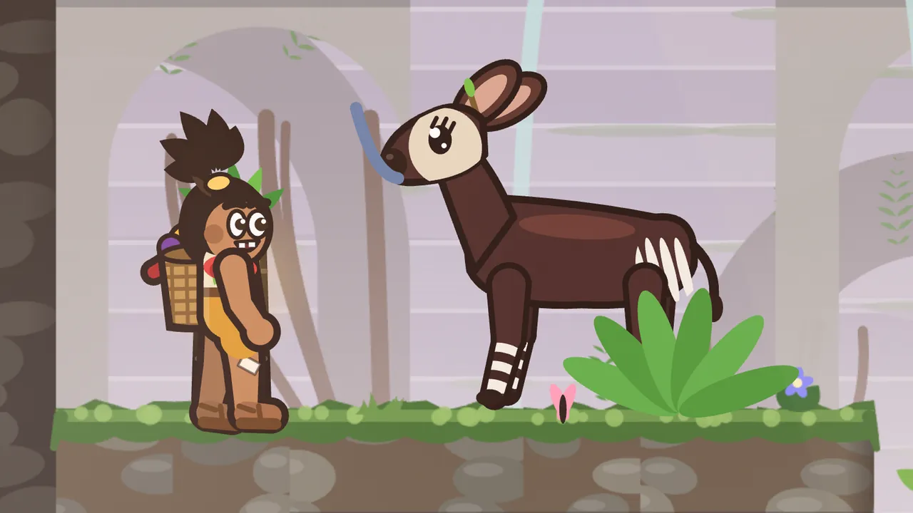 In Mossgate Ruins, Socks the okapi, drawn large, a dark brown animal with a pale face mask, big ears with a little green twig clip on one of them, long lashes, white stripes on his rump and striped legs, stands by a green fern and curls a long blue tongue up from his mouth in a quick lick, while Tavo, a boy with a topknot and a woven fruit basket on his back, stands on the mossy ledge on the left and grins at him; a pink butterfly sits in the grass, a small purple flower grows by the edge, and pale stone arches with thin waterfalls rise in the lilac mist behind them
