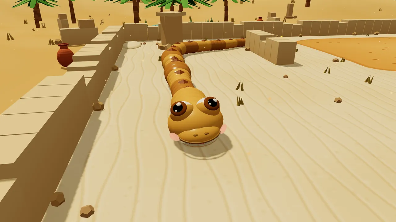 Sandy, a golden snake with big brown eyes, pink cheeks and a row of brown diamond-shaped bumps down the back, slides head first toward the viewer along a path of pale rippled sand between two low walls of old sandstone ruins, the long body curving back past a stone pillar, with a red clay jar on the wall at the left, palm trees and sand dunes behind and a patch of orange sand on the right