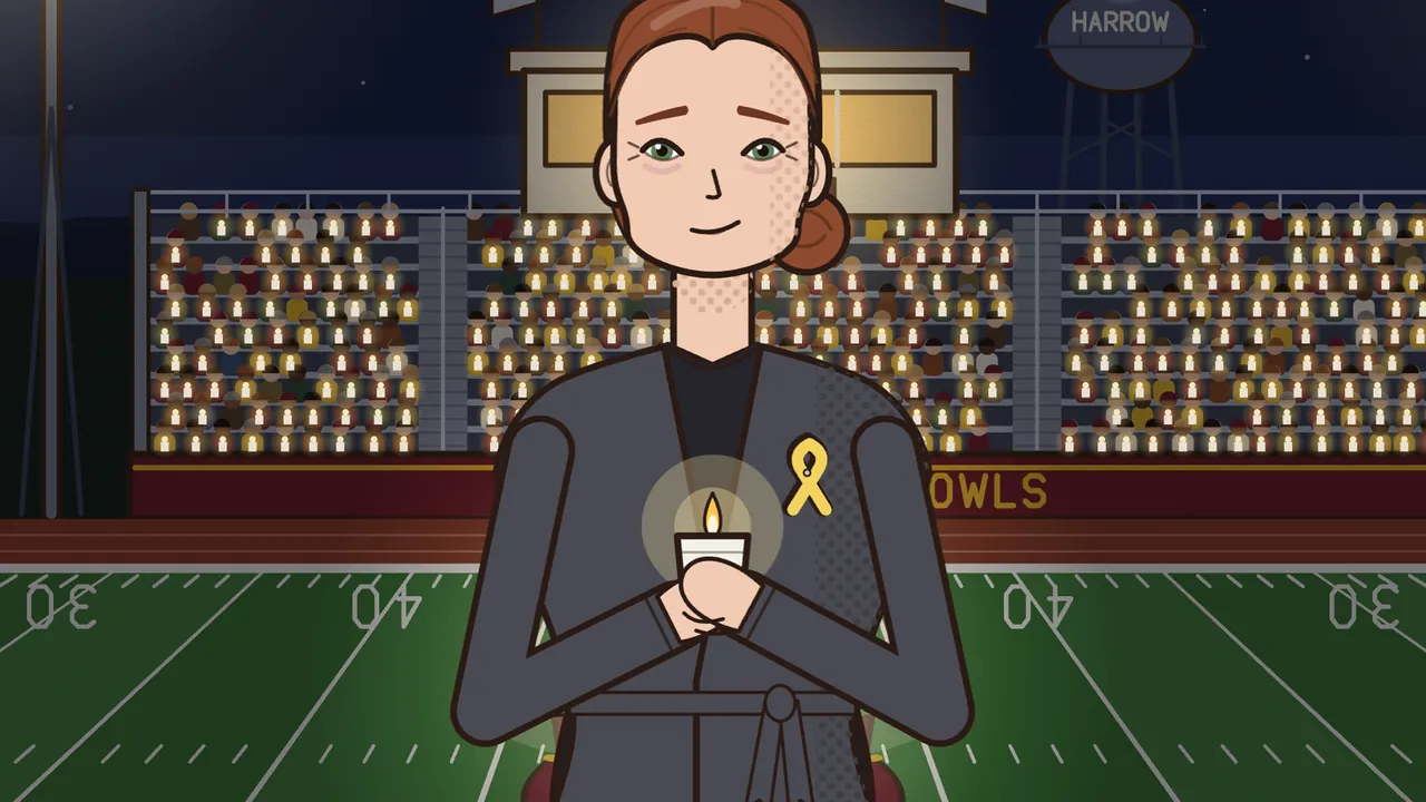 Kim Calloway at the halftime vigil, close up: a woman with auburn hair in a low bun and a gentle, tired smile, in a dark gray wrap jacket with a yellow ribbon pinned to it, holds a lit candle in a paper cup at her chest; behind her, the stands are full of people holding candles, under the press box and a water tower marked HARROW, and the green field stretches out on both sides